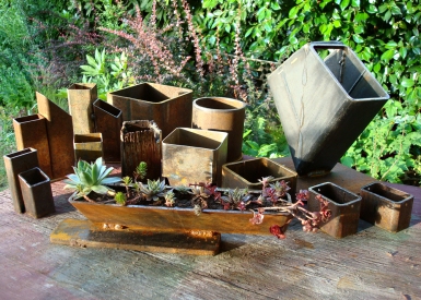 summer planters - variety of planters from scrap steel and industrial drops