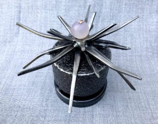 Thistle- 5" W x 3"H. bead, copper wire, oxidized steel, gear assembly, square cut nails and spiral nails.
