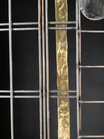 Detail: Scrappy Moongate, 6.5'Hx36"W, brass and reclaimed steel.